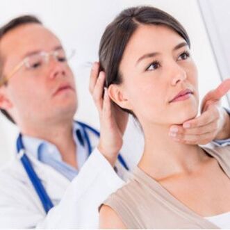 Neurologist examines a patient who has neck pain